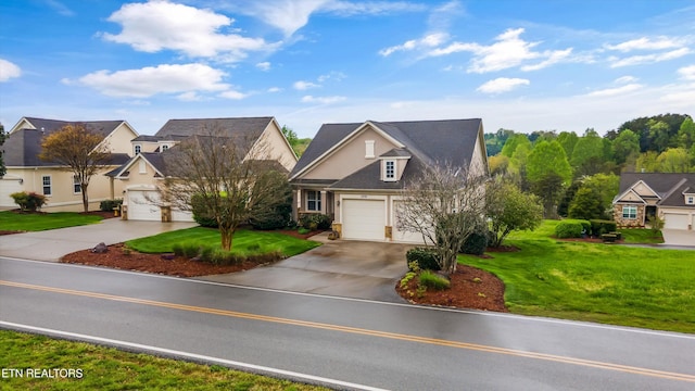 1079 Rarity Bay Pkwy, Vonore, TN 37885 - view of front of house with concrete driveway, an attached garage, a residential view, and a front yard
