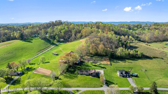 birds eye view of property with a rural view