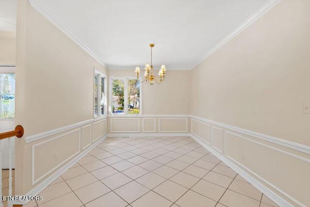 unfurnished dining area featuring a chandelier, a healthy amount of sunlight, and crown molding