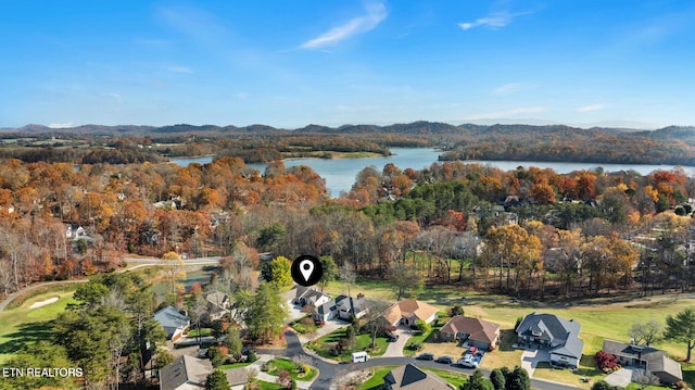 bird's eye view with a residential view, a view of trees, and a water and mountain view