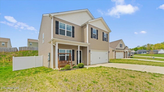 view of front of property with fence, a front lawn, a residential view, an attached garage, and driveway