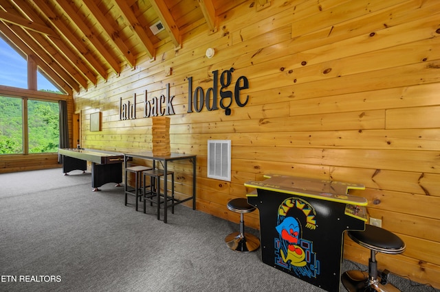 playroom featuring lofted ceiling with beams, visible vents, wood walls, wood ceiling, and carpet floors