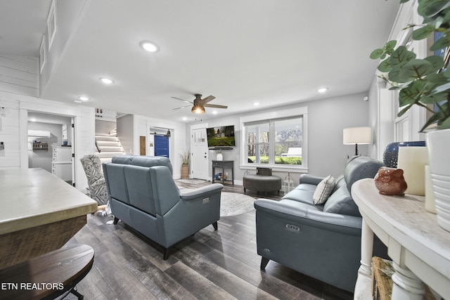 living room featuring recessed lighting, dark wood finished floors, a ceiling fan, and stairs
