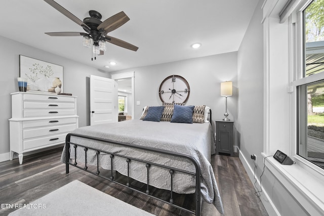 bedroom featuring recessed lighting, ceiling fan, baseboards, and dark wood-style flooring