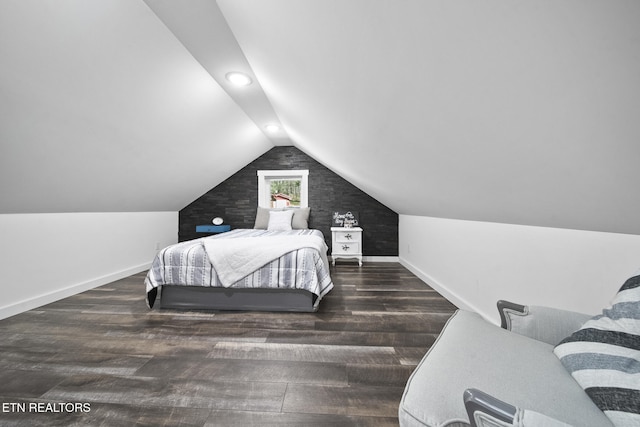 bedroom with lofted ceiling, wood finished floors, baseboards, and recessed lighting