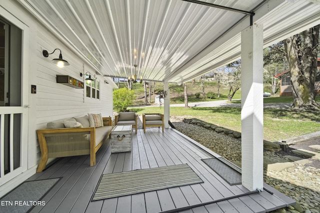 wooden deck featuring a lawn and an outdoor hangout area