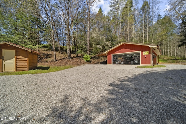 view of yard with an outbuilding and a garage