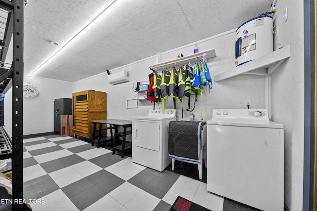 clothes washing area with washing machine and clothes dryer and a textured ceiling