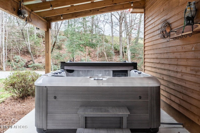 exterior details with a hot tub