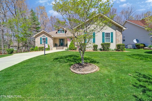 view of front of home featuring stone siding and a front yard