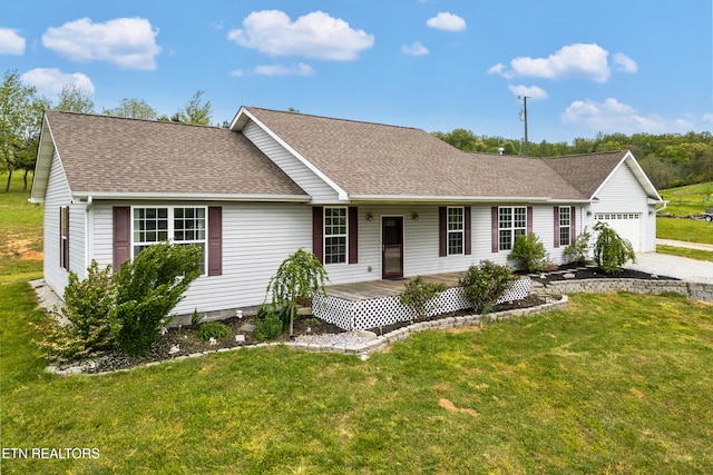 283 Red Hill Rd, Andersonville, TN 37705 - ranch-style house featuring a porch, a shingled roof, an attached garage, a front yard, and driveway