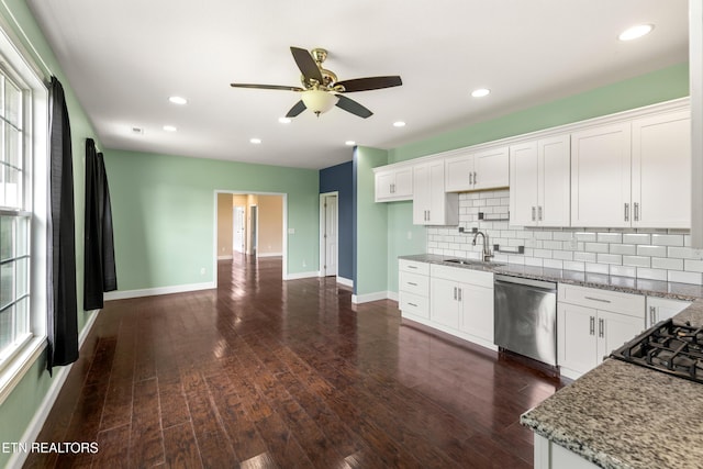 283 Red Hill Rd, Andersonville, TN 37705 - kitchen featuring stainless steel dishwasher, a sink, backsplash, white cabinets, and baseboards