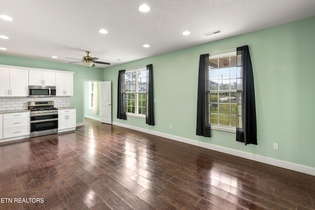 283 Red Hill Rd, Andersonville, TN 37705 - kitchen featuring stainless steel appliances, ceiling fan, baseboards, tasteful backsplash, and white cabinetry