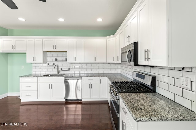 283 Red Hill Rd, Andersonville, TN 37705 - kitchen with stainless steel appliances, a sink, stone counters, white cabinets, and recessed lighting