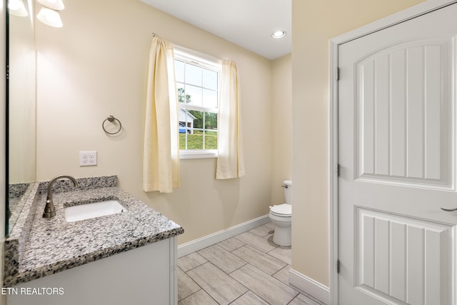 283 Red Hill Rd, Andersonville, TN 37705 - bathroom with baseboards, toilet, vanity, and recessed lighting