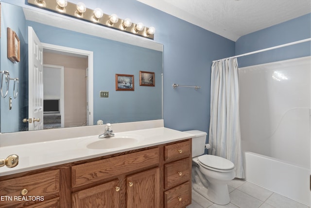 bathroom with tile patterned floors, shower / bathtub combination with curtain, toilet, vanity, and a textured ceiling