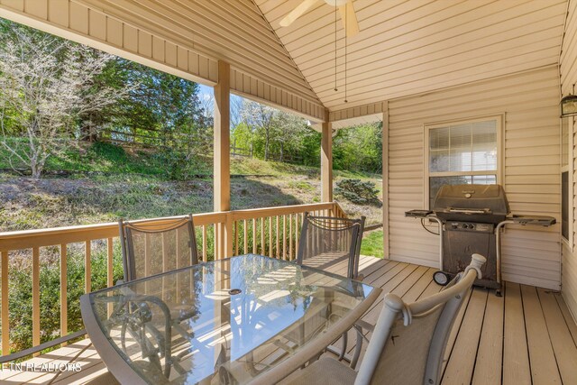 wooden terrace featuring outdoor dining area and area for grilling