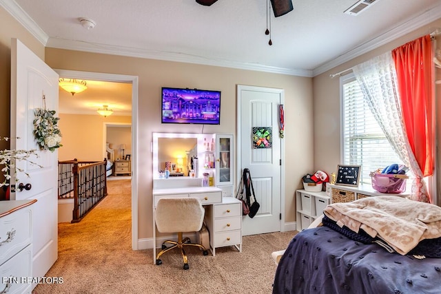 bedroom with light colored carpet, ceiling fan, ornamental molding, and visible vents