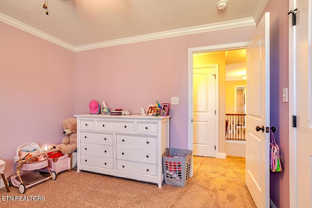 playroom with light carpet and crown molding
