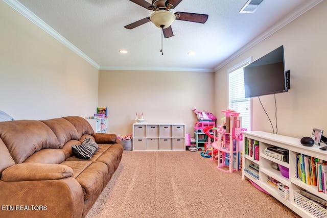 recreation room featuring recessed lighting, visible vents, a ceiling fan, ornamental molding, and carpet floors