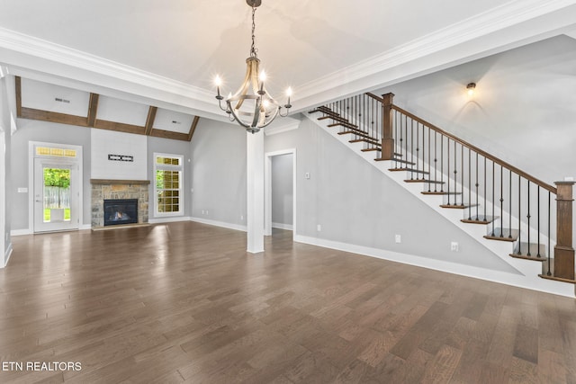 1416 Ebenezer Rd, Knoxville, TN 37922 - unfurnished living room featuring an inviting chandelier, baseboards, dark wood-style flooring, and stairs