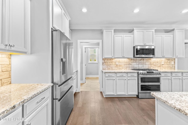 1416 Ebenezer Rd, Knoxville, TN 37922 - kitchen with white cabinets, stainless steel appliances, and wood finished floors
