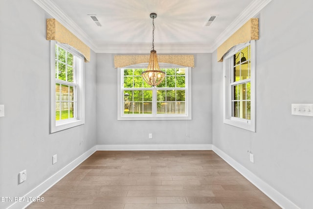 1416 Ebenezer Rd, Knoxville, TN 37922 - unfurnished dining area featuring crown molding, visible vents, wood finished floors, and a notable chandelier