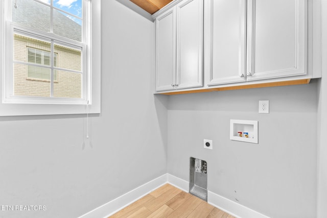 1416 Ebenezer Rd, Knoxville, TN 37922 - clothes washing area featuring washer hookup, hookup for an electric dryer, light wood-type flooring, cabinet space, and baseboards