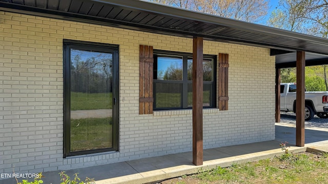 2315 Pine Grove Rd, Winfield, TN 37892 - view of side of home featuring brick siding and a porch