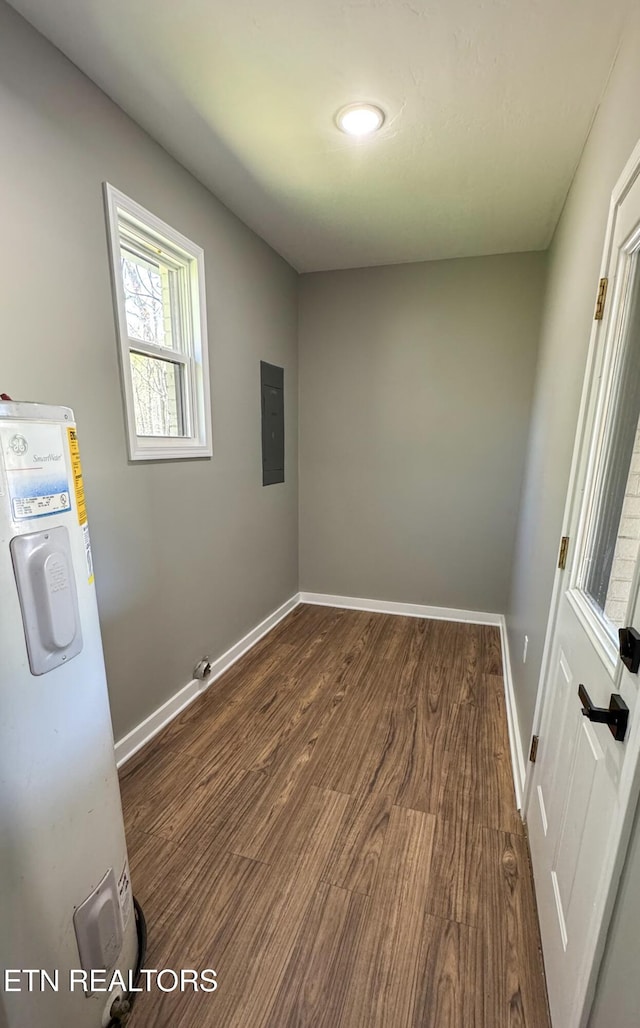 2315 Pine Grove Rd, Winfield, TN 37892 - empty room with dark wood finished floors, water heater, electric panel, and baseboards