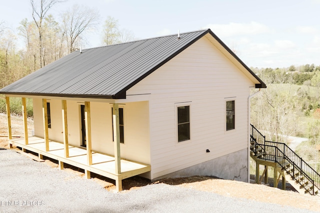 162 Wilderness Dr, New Tazewell, TN 37825 - back of house featuring metal roof and stairway