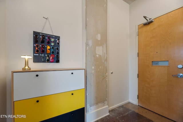 interior space featuring baseboards