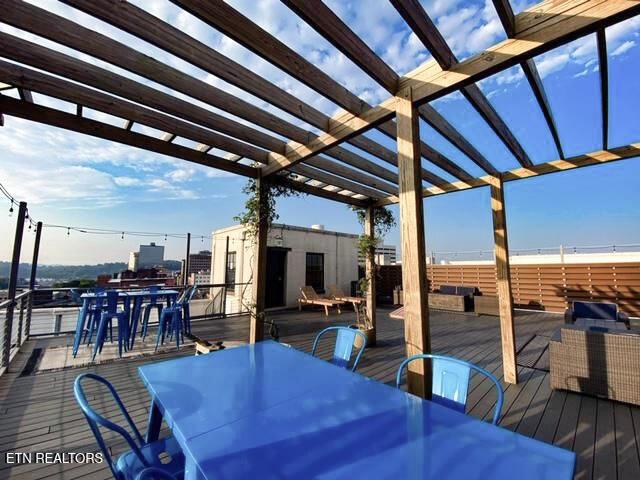 wooden deck with outdoor dining space