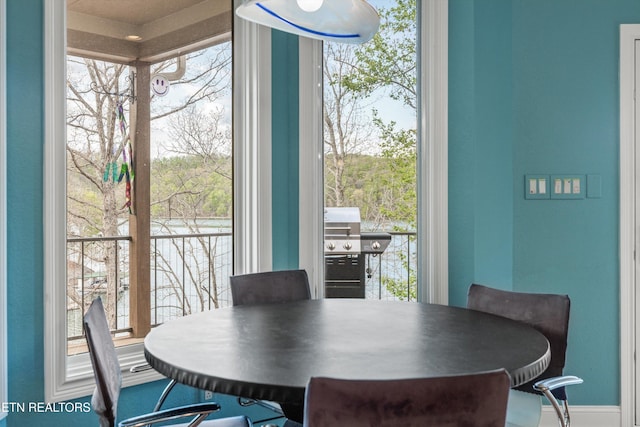dining area featuring baseboards