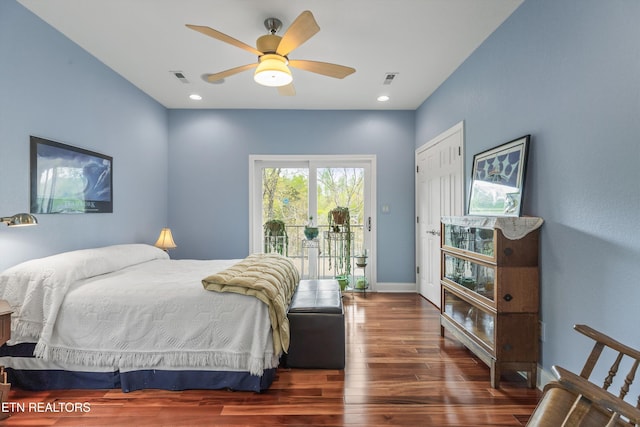 bedroom featuring access to exterior, visible vents, baseboards, wood finished floors, and ceiling fan