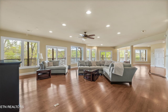 living room with baseboards, a ceiling fan, wood finished floors, and recessed lighting