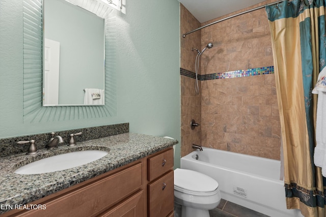 full bathroom with tile patterned floors, toilet, shower / bathtub combination with curtain, a textured wall, and vanity
