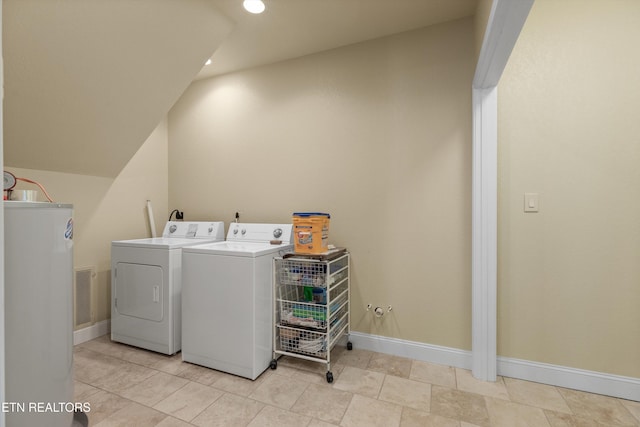 washroom featuring washing machine and clothes dryer, laundry area, baseboards, visible vents, and recessed lighting