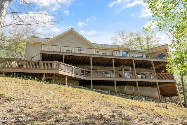 rear view of house featuring a deck