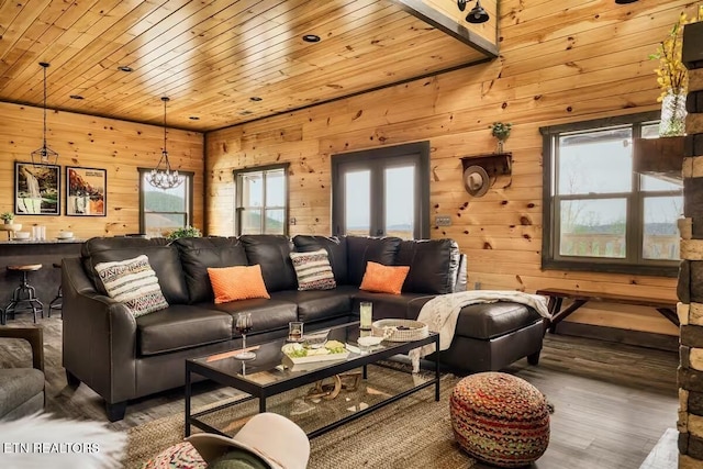 914 Crooked Ridge Rd, Gatlinburg, TN 37738 - living area with wood ceiling, an inviting chandelier, wood finished floors, and wooden walls