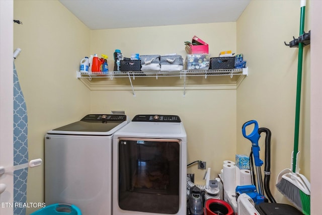 washroom featuring washer and dryer and laundry area