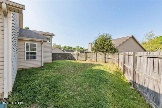 view of yard featuring a fenced backyard