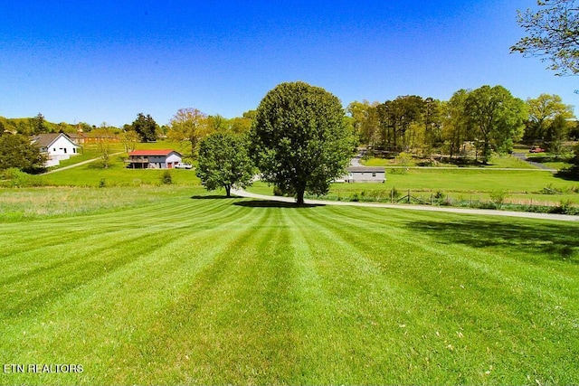 view of property's community featuring a yard