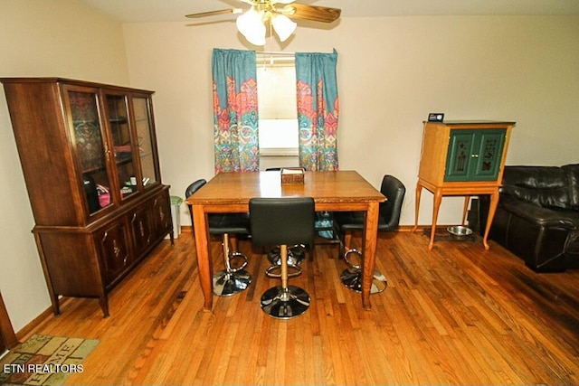 dining area featuring ceiling fan and wood finished floors