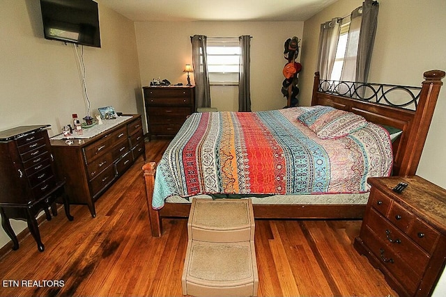bedroom featuring dark wood-type flooring