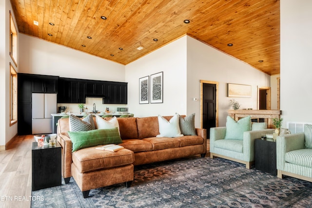living room with wooden ceiling, light wood finished floors, and high vaulted ceiling