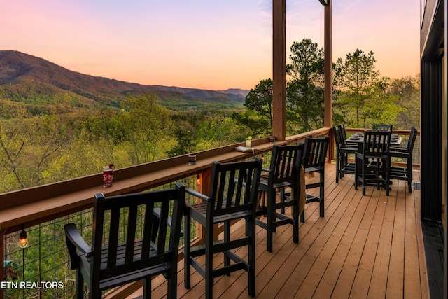wooden terrace with a mountain view
