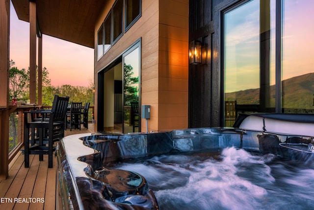 exterior space featuring a hot tub