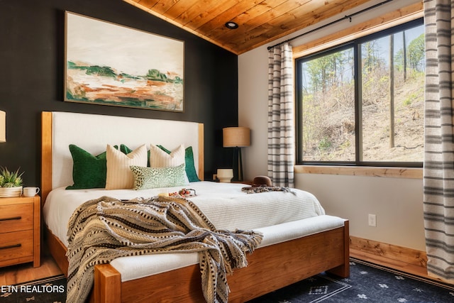 bedroom featuring wooden ceiling and lofted ceiling