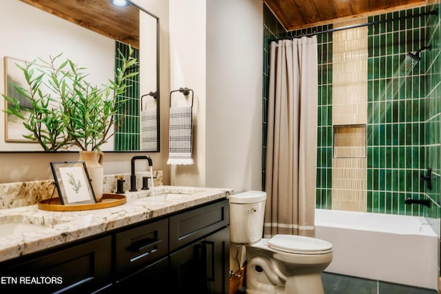 bathroom with double vanity, toilet, shower / bath combo, a sink, and tile patterned floors